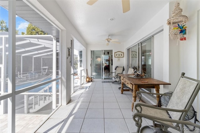 sunroom / solarium with ceiling fan and plenty of natural light