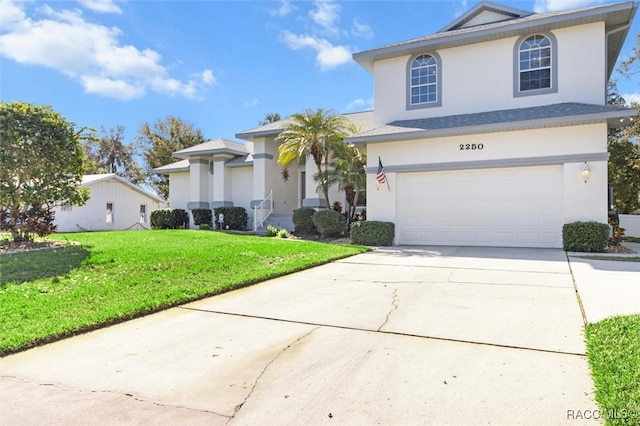 view of front of home with a garage and a front lawn