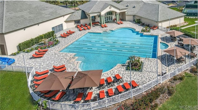 pool featuring a patio and fence