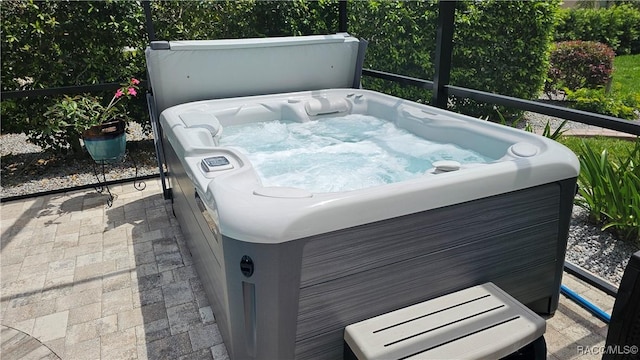 exterior space with a hot tub