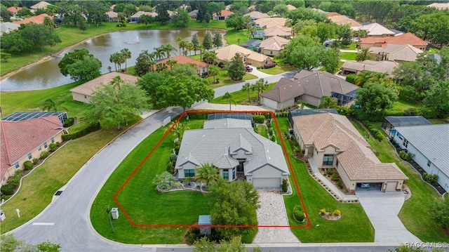 aerial view featuring a residential view and a water view