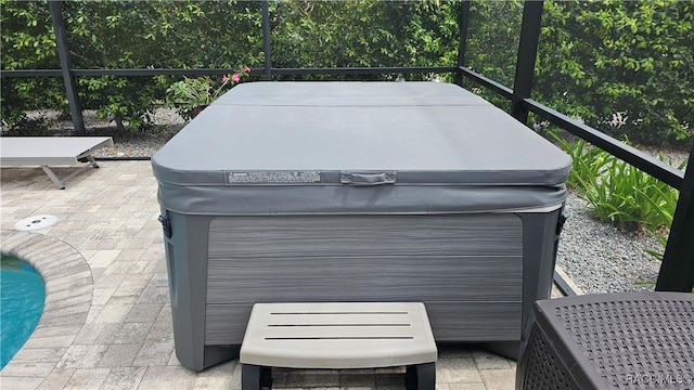 exterior space with a pool and a hot tub