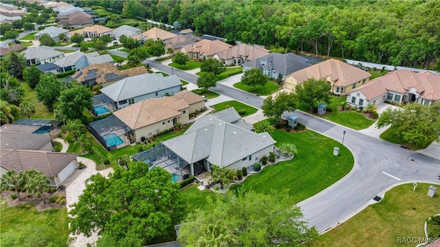 birds eye view of property with a residential view