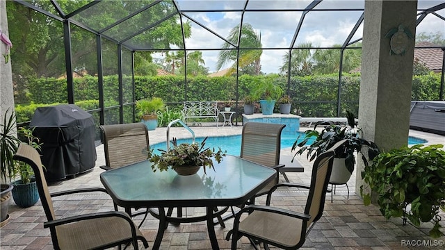sunroom featuring outdoor dining area
