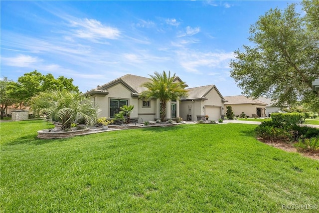 ranch-style house featuring concrete driveway, stucco siding, an attached garage, a front yard, and a tile roof