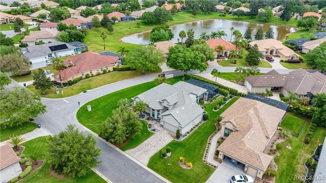birds eye view of property with a residential view and a water view