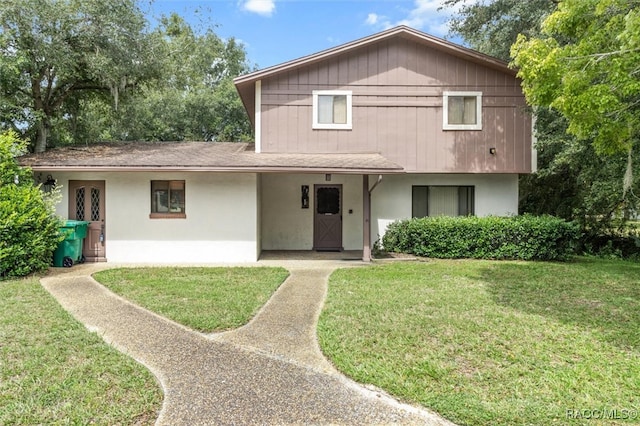 view of front of home with a front lawn