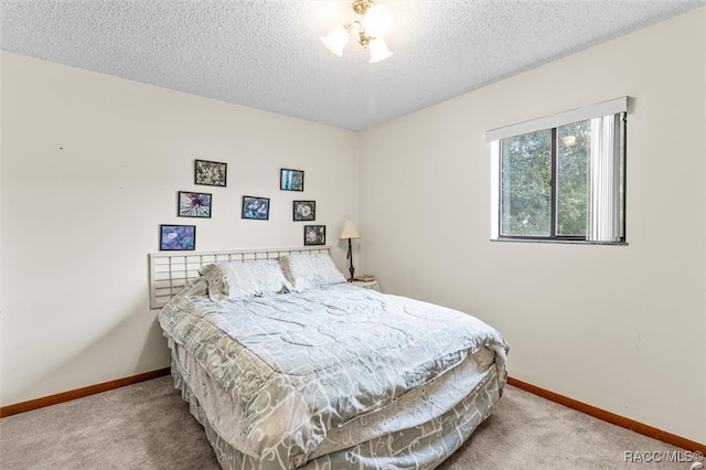 carpeted bedroom with a textured ceiling