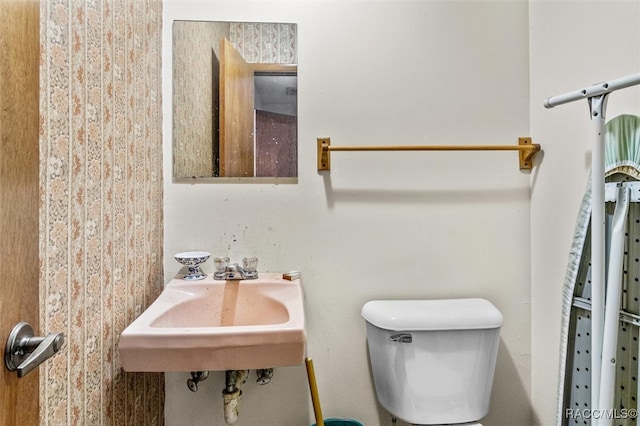 bathroom featuring sink and toilet