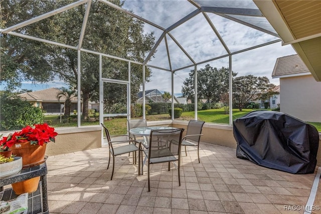 view of patio / terrace featuring a lanai and a grill