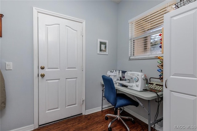 home office with dark hardwood / wood-style floors