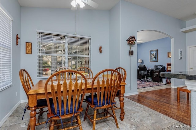 dining area with ceiling fan and lofted ceiling