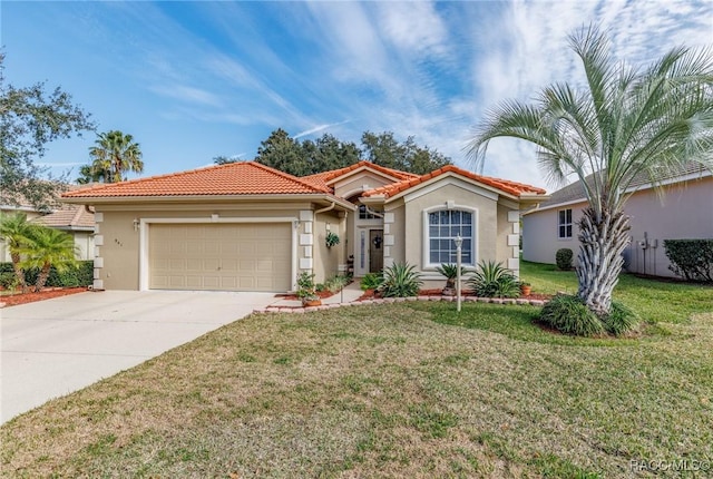 mediterranean / spanish-style house featuring a front lawn and a garage