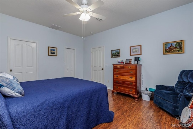 bedroom featuring dark hardwood / wood-style floors and ceiling fan