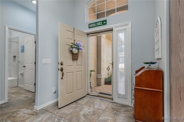 entrance foyer with a towering ceiling