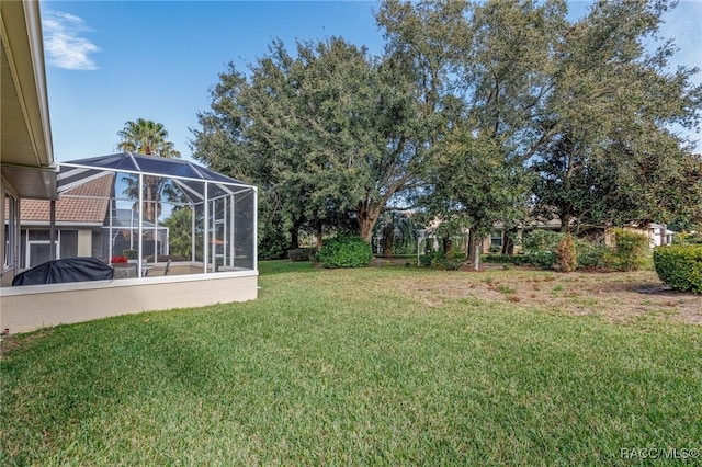 view of yard featuring a lanai