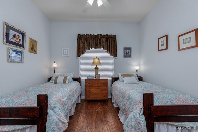 bedroom with ceiling fan and dark wood-type flooring