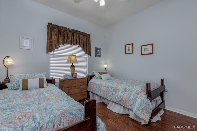 bedroom featuring ceiling fan and dark hardwood / wood-style flooring