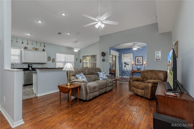 living room featuring ceiling fan, dark hardwood / wood-style floors, sink, and vaulted ceiling