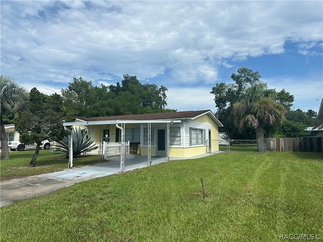 view of front of house with a front lawn and a porch