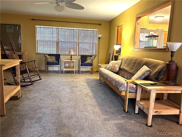 living room with carpet floors and ceiling fan