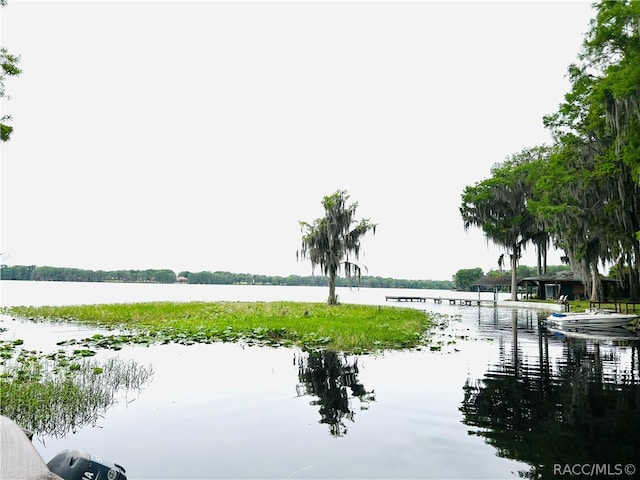 surrounding community featuring a water view