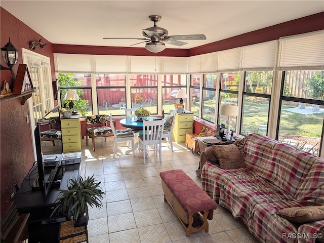 sunroom with ceiling fan