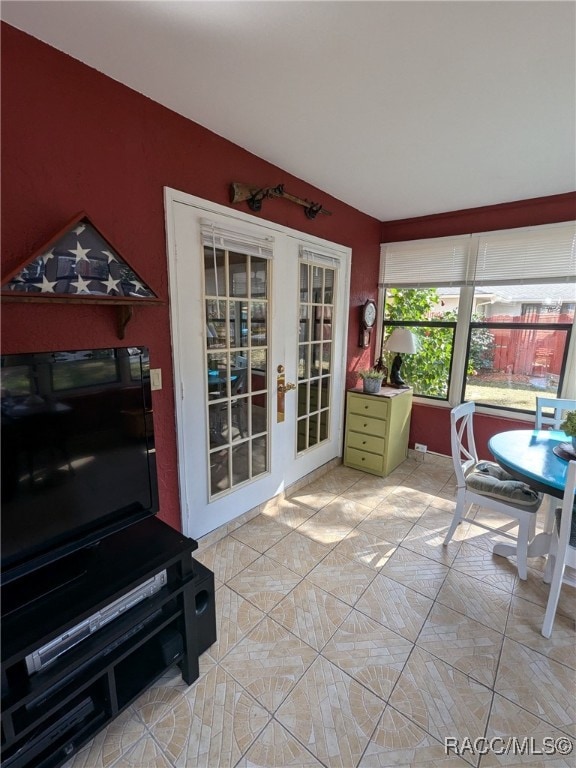 sunroom featuring french doors