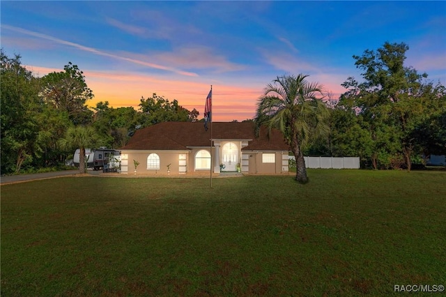 view of front of house with a lawn