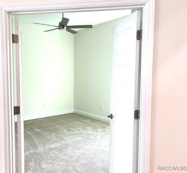 empty room with carpet floors and ceiling fan