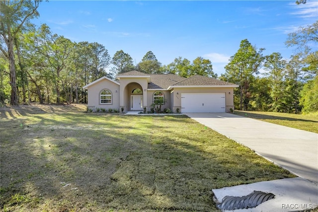 view of front of house with a front lawn and a garage