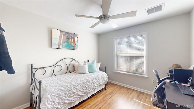 bedroom featuring wood-type flooring and ceiling fan