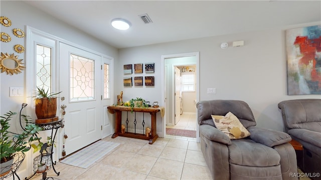 foyer entrance with light tile patterned floors