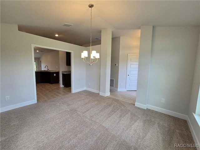 4953 N Triple Eagle Path, Beverly Hills, FL 34465 - empty room with a chandelier and light carpet