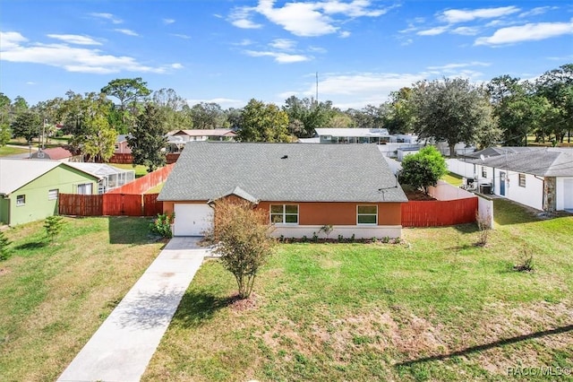 exterior space with a garage and a front yard