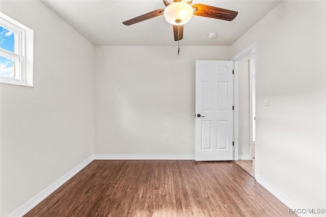 unfurnished room featuring hardwood / wood-style flooring and ceiling fan