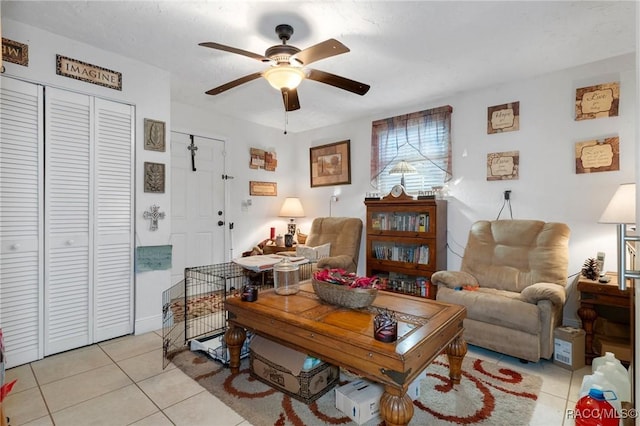 tiled living room featuring ceiling fan