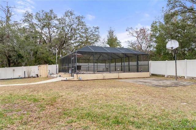 view of yard featuring a patio area and a lanai