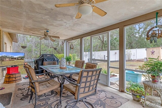 view of front of property featuring a front yard, central AC unit, and a garage