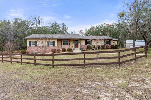 ranch-style house with a front lawn