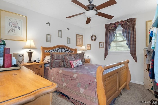 bedroom featuring ceiling fan and light colored carpet