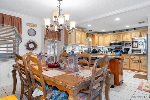 tiled dining area featuring crown molding, sink, a chandelier, and a textured ceiling