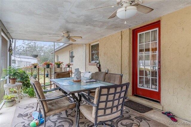 view of front of property with a front yard and a sunroom