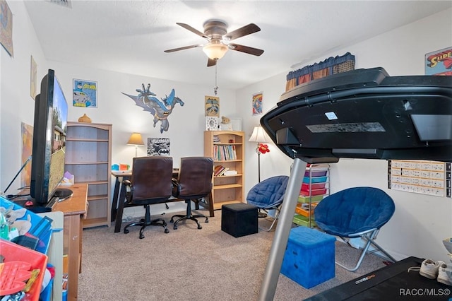 office area with ceiling fan and light carpet