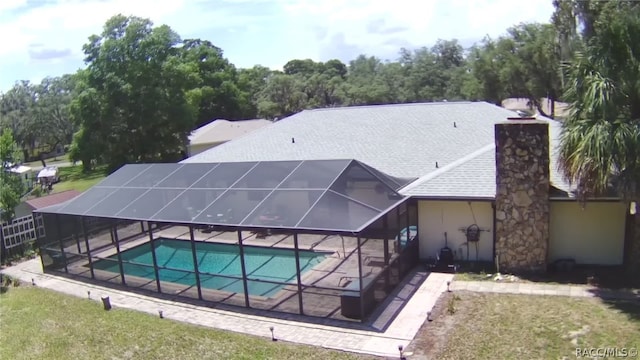 view of pool featuring a patio area and a lanai