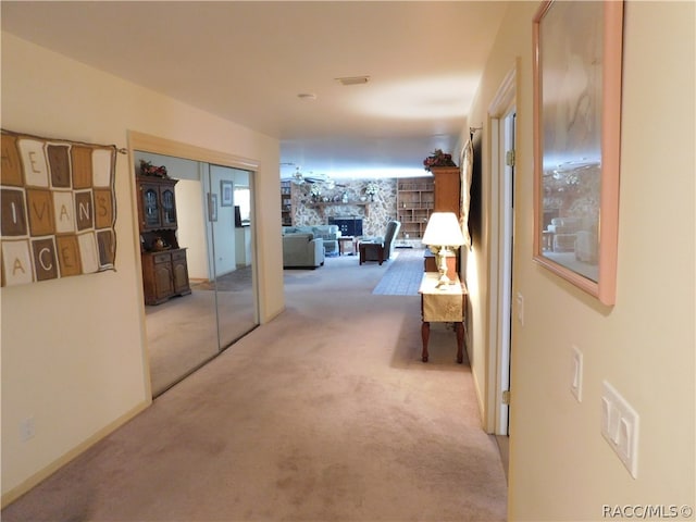 hallway with light colored carpet