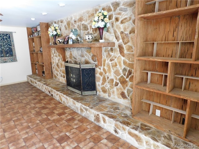 unfurnished living room featuring a fireplace