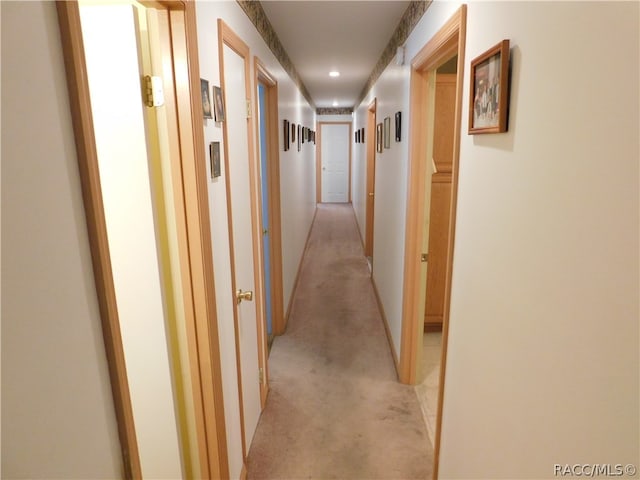 corridor with light colored carpet