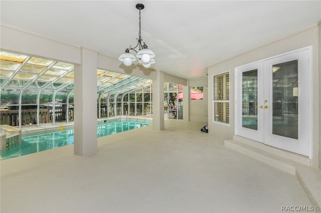 view of swimming pool featuring french doors