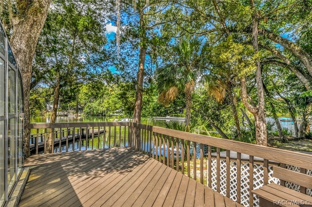 wooden deck featuring a water view